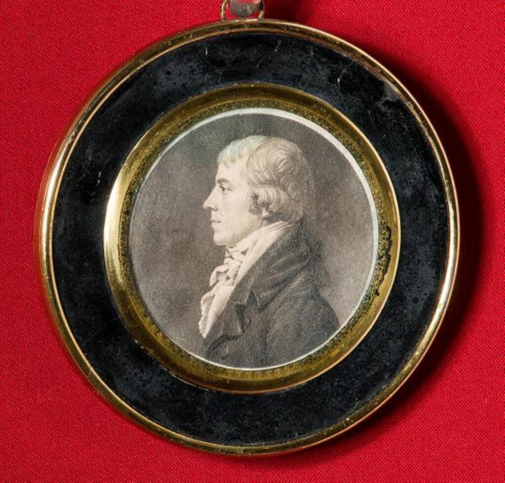 Circle medallion with a profile of John Wickham. 