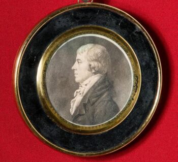 Circle medallion with a profile of John Wickham.
