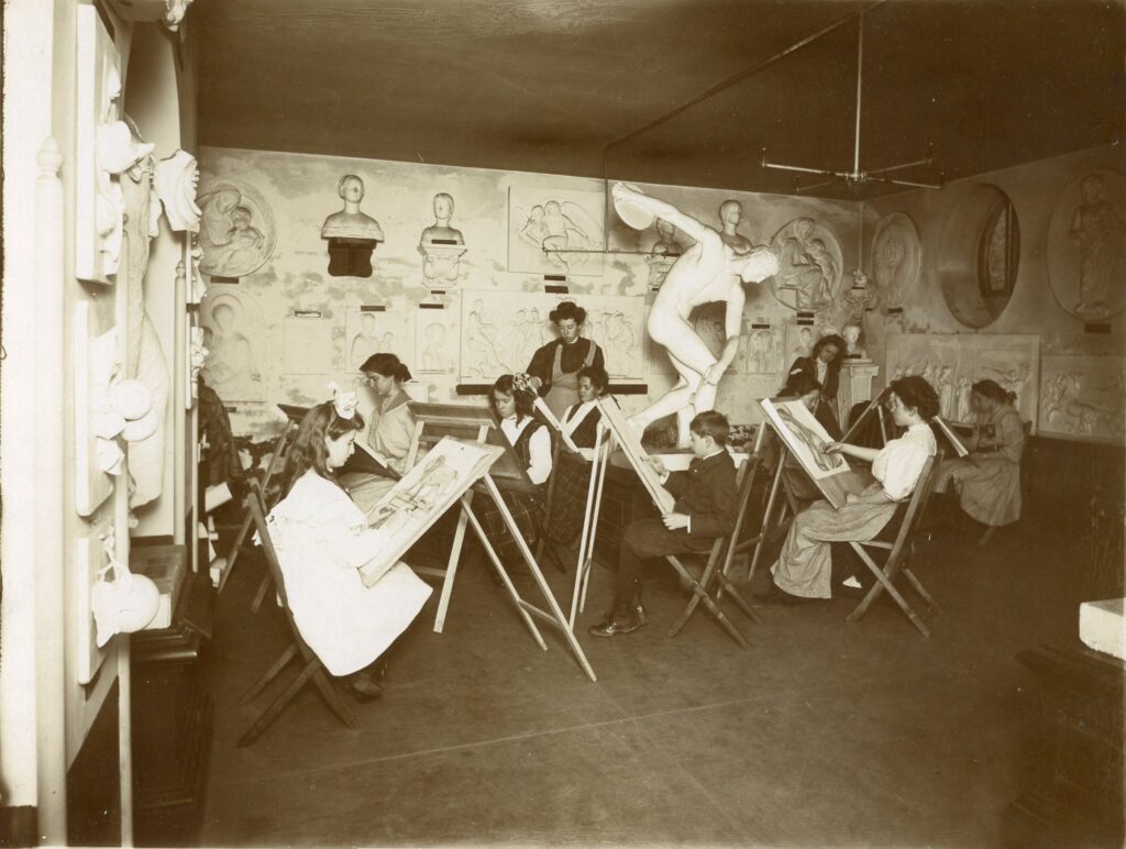 View of the early Valentine Museum with art students drawing on easels surrounded by casts of Greek and Roman sculptures.