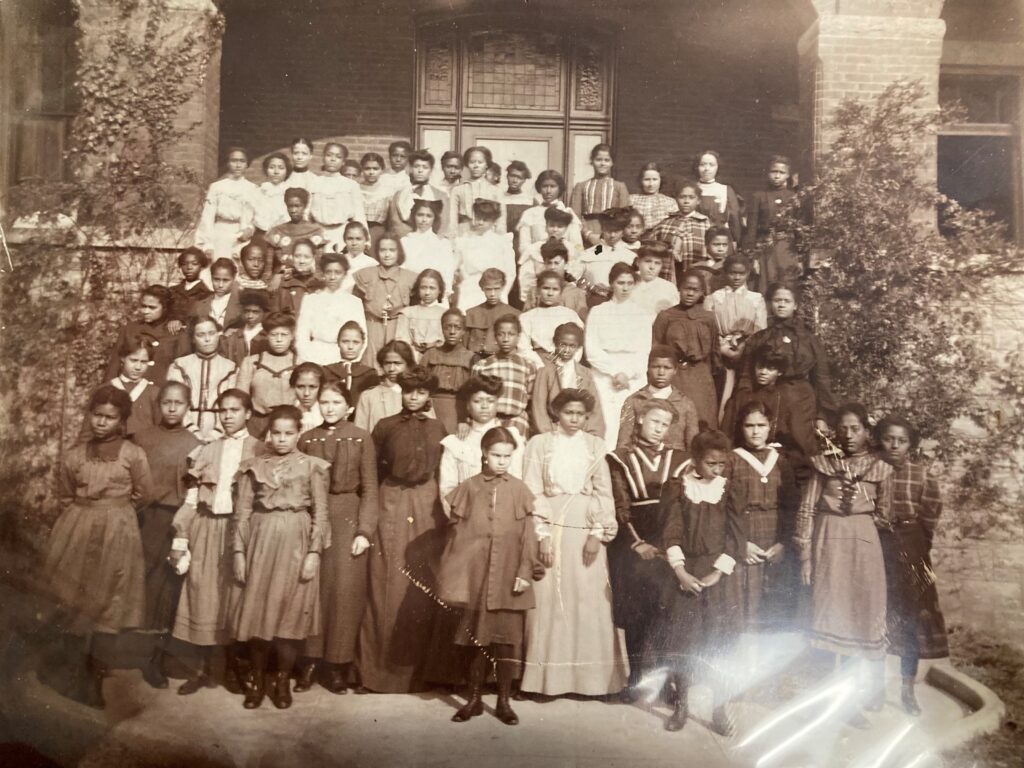 Large group of Black young woman gathered on the school steps of St Francis de Sales school in Powhatan County, near Richmond